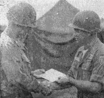 BG Glenn Walker presents check to Cpt. Neal Christensen