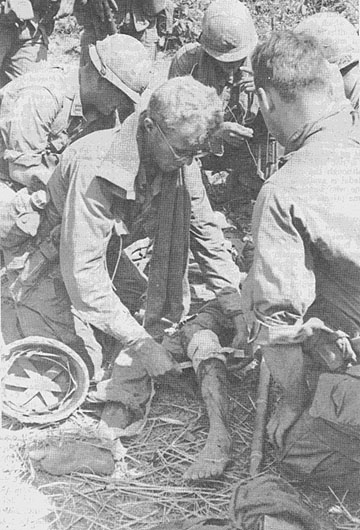 PFC Michael Burris treats enemy