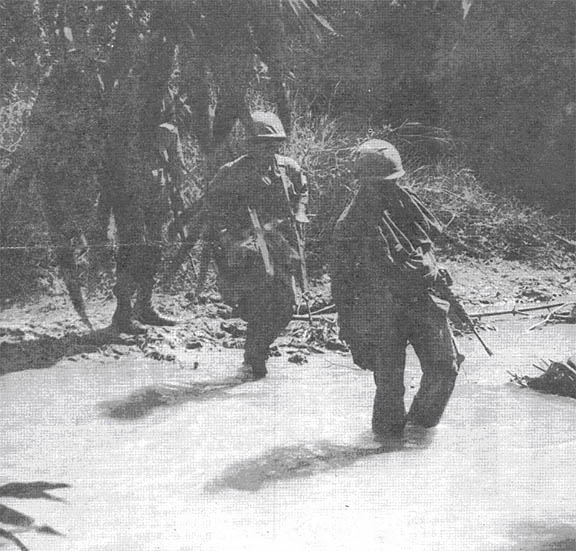 Manchus crossing stream