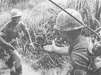 Sgt Eugene Weems crossing stream