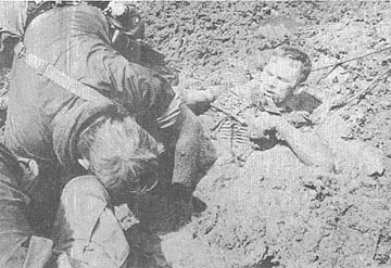 PFC Donald Rummel in the mud