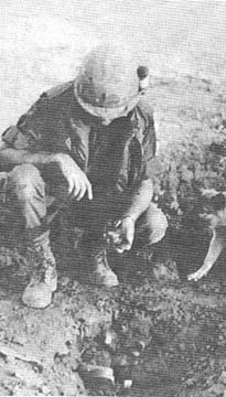 Ronald Schuckman examines crater