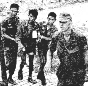 Cpt. Thomas Casey with NVA prisoner