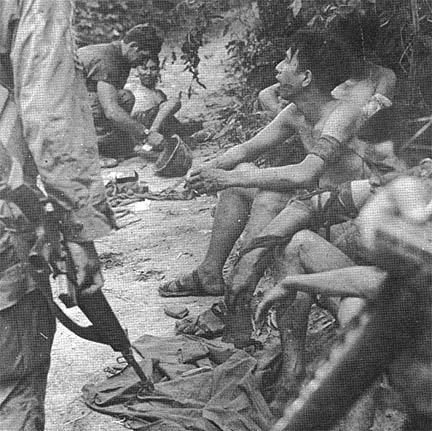 NVA Detainees wait for medic