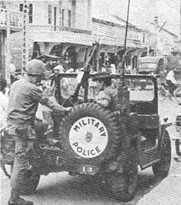 SP4 Harry W. Alfred, 545th MP Co, and Nguyen Thuong, interpreter