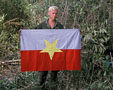 Kent Oyler with NVA flag